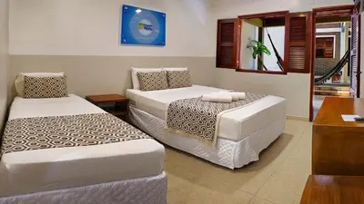 Uma cama ou camas num quarto em Rede Andrade Pousada do Norte