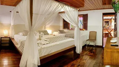 Uma cama ou camas num quarto em Rede Andrade Pousada do Norte