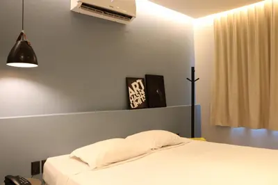 Uma cama ou camas num quarto em Fortpraia Hotel