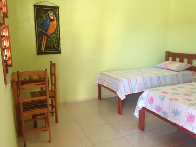 Uma cama ou camas num quarto em Pousada Muiraquitã
