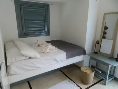 Uma cama ou camas num quarto em Pousada Recanto Beija-Flor
