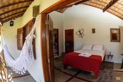 Uma cama ou camas num quarto em Pousada Bate Vento