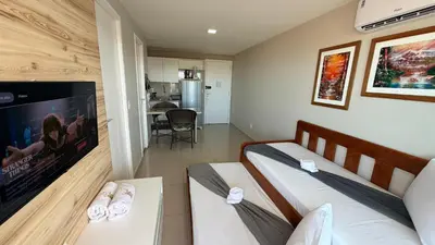 Uma televisão e/ou sistema de entretenimento em Apartments Vg Fun Praia do Futuro