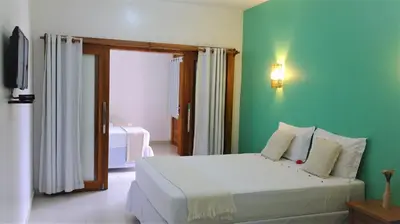 Uma cama ou camas num quarto em Pousada Jeri Dunas