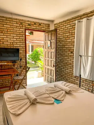 Uma cama ou camas num quarto em Pousada La Goduria