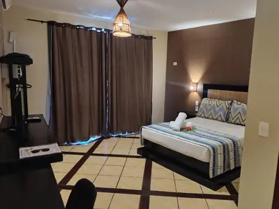 Uma cama ou camas num quarto em Pousada Aruana