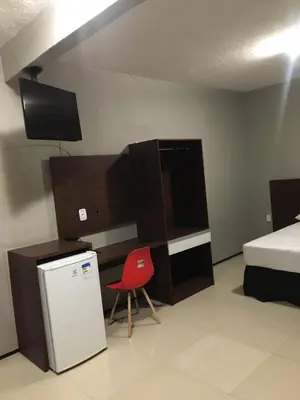 Uma cama ou camas num quarto em Abolição Praia Hotel