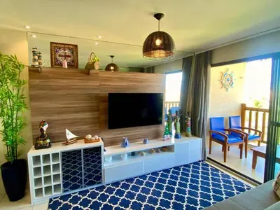 Uma televisão e/ou sistema de entretenimento em VG Sun Cumbuco - Apartamento de Temporada na Praia do Cumbuco