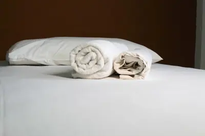 Uma cama ou camas num quarto em Hotel Centro Fashion