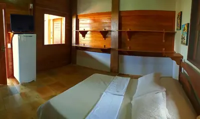 Uma cama ou camas num quarto em Pousada Sahara