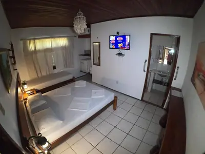 Uma cama ou camas num quarto em Pousada Casa Do Angelo