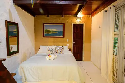 Uma cama ou camas num quarto em Olho D'Água Pousada