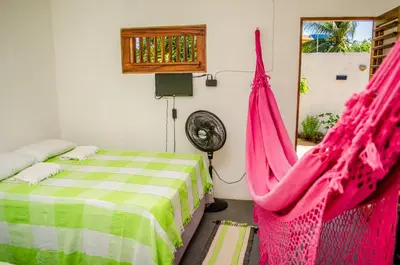 Uma cama ou camas num quarto em B&B Chalé Jardins