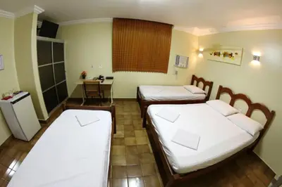 Uma cama ou camas num quarto em Hotel Belem Fortaleza