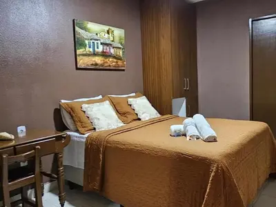 Uma cama ou camas num quarto em Pousada Tartaruga Cumbuco