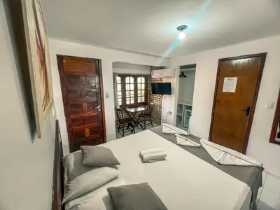 Uma cama ou camas num quarto em Falésia Praia Hotel