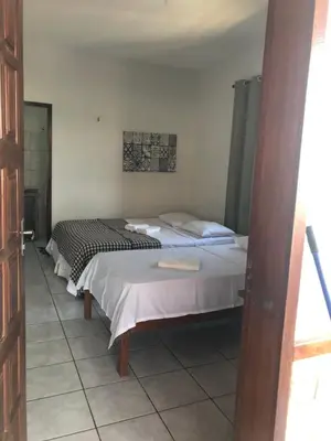 Uma cama ou camas num quarto em Pousada do Holandês