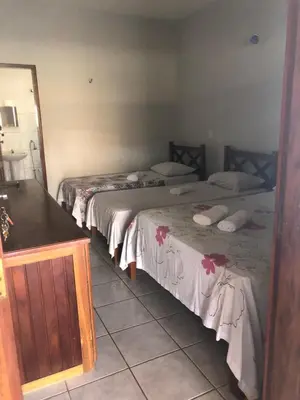 Uma cama ou camas num quarto em Pousada do Holandês