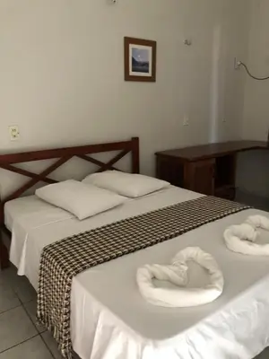 Uma cama ou camas num quarto em Pousada do Holandês