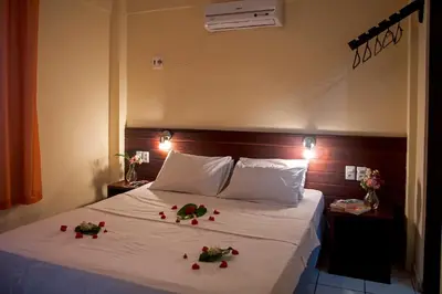 Uma cama ou camas num quarto em Pousada California