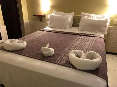 Uma cama ou camas num quarto em Pousada Alternativa