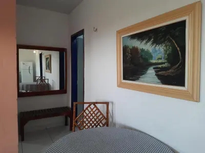 Uma cama ou camas num quarto em Pousada Alecrim