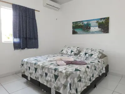 Uma cama ou camas num quarto em Pousada Alecrim