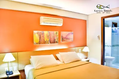 Uma cama ou camas num quarto em Kariri Beach Hotel