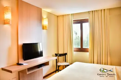 Uma televisão e/ou sistema de entretenimento em Kariri Beach Hotel