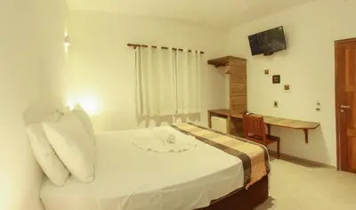 Uma cama ou camas num quarto em Azul Pousada