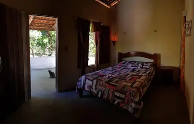 Uma cama ou camas num quarto em Rancho Colcha de Retalho
