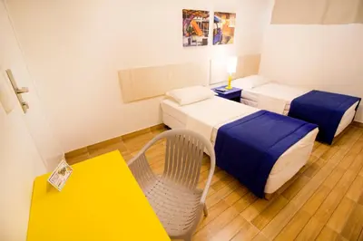 Uma cama ou camas num quarto em Hotel Villa Smart