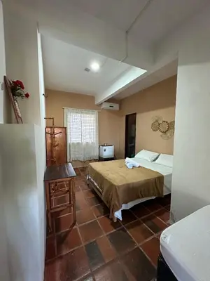 Uma cama ou camas num quarto em Pousada Casa do Josef