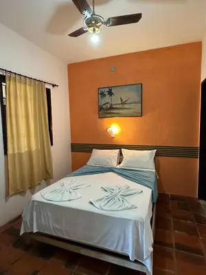 Uma cama ou camas num quarto em Pousada Casa do Josef