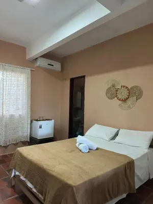 Uma cama ou camas num quarto em Pousada Casa do Josef