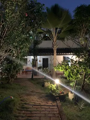 Um jardim no exterior de Pousada Casa do Josef