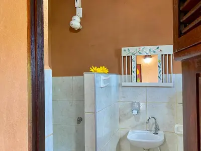 Uma casa de banho em Pousada Le Monte Cristo