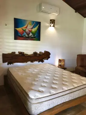Uma cama ou camas num quarto em Hotel Pousada Beleza das Ondas
