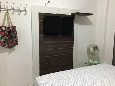 Uma cama ou camas num quarto em Condomínio Palm Beach