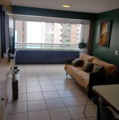Uma área de estar em Apartamento Em Fortaleza De Frente Para O Mar