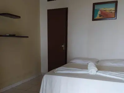 Uma cama ou camas num quarto em Pousada Via Lactea