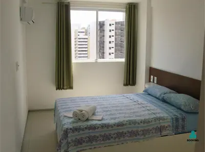 Uma cama ou camas num quarto em Brisa do Mar Apartments