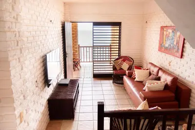 Uma área de estar em Casa triplex Lagoinha