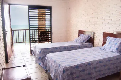 Uma cama ou camas num quarto em Casa triplex Lagoinha