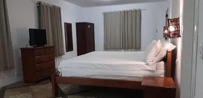 Uma cama ou camas num quarto em Pousada Vale do Luar