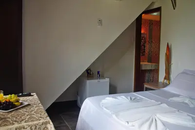Uma cama ou camas num quarto em Pousada Presidente Hotel