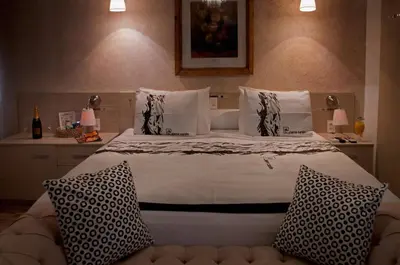 Uma cama ou camas num quarto em Pousada Presidente Hotel