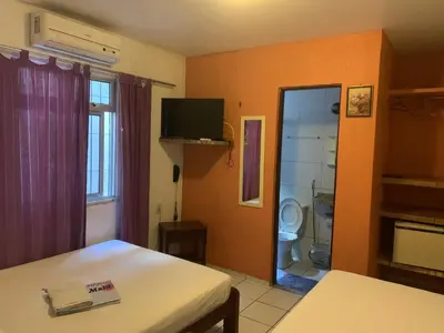 Uma cama ou camas num quarto em Pousada Malu