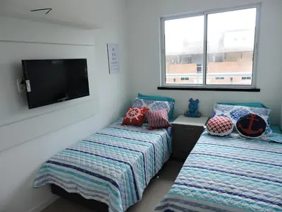 Uma cama ou camas num quarto em Apartamento com vista pro mar - Beach Way