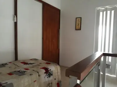 Uma cama ou camas num quarto em Apartamento Taíba Beach Resort